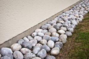 rocks around home exterior for drainage